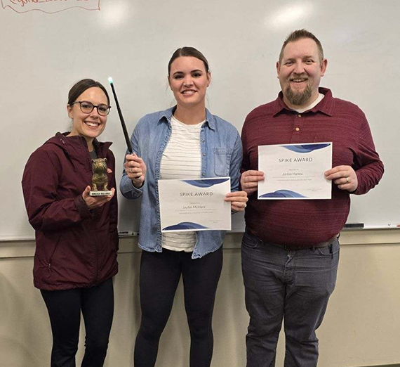 Brenna Messner sitting in nursing lab looking away from the camera.